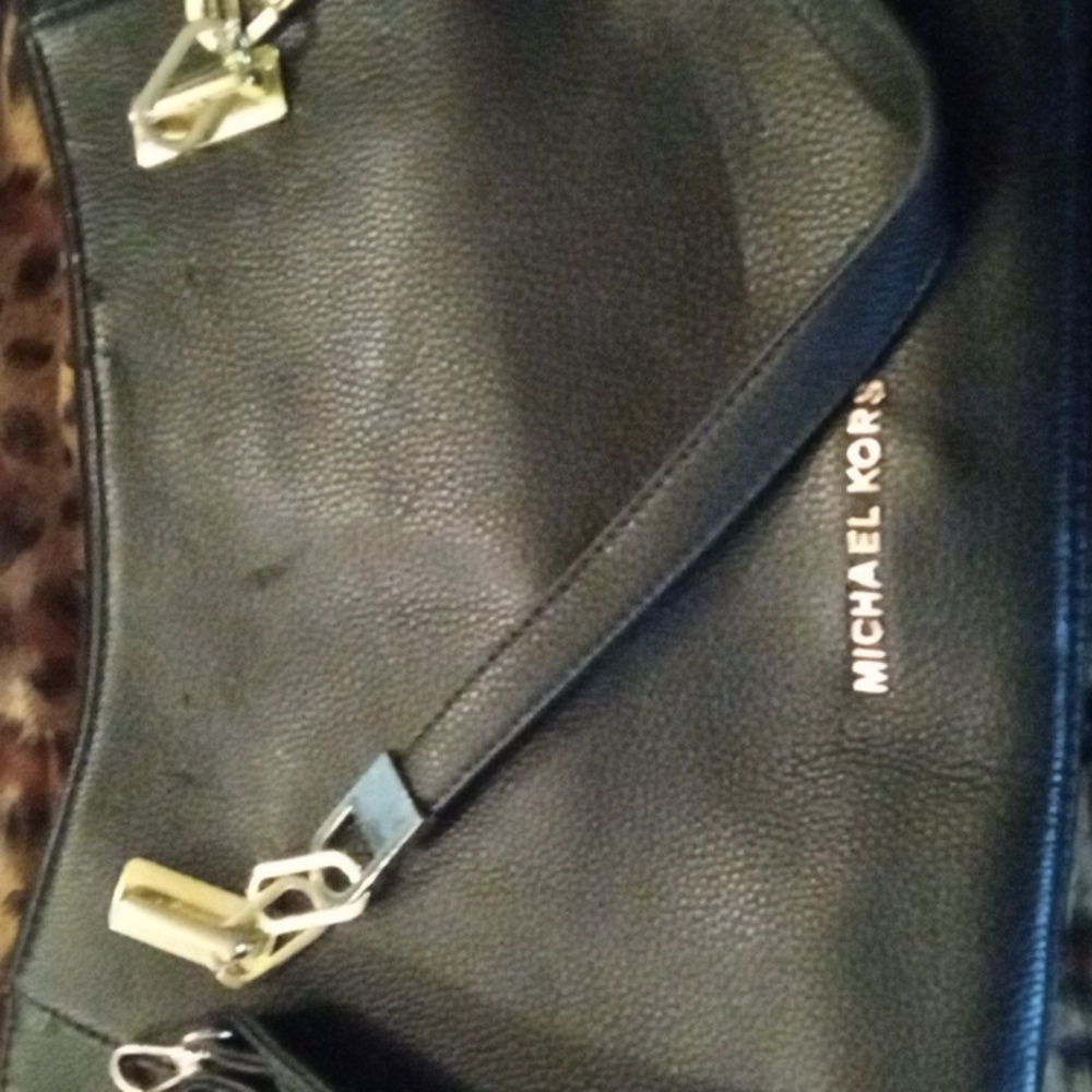 Micheal kors tote gently used has a slight ding black